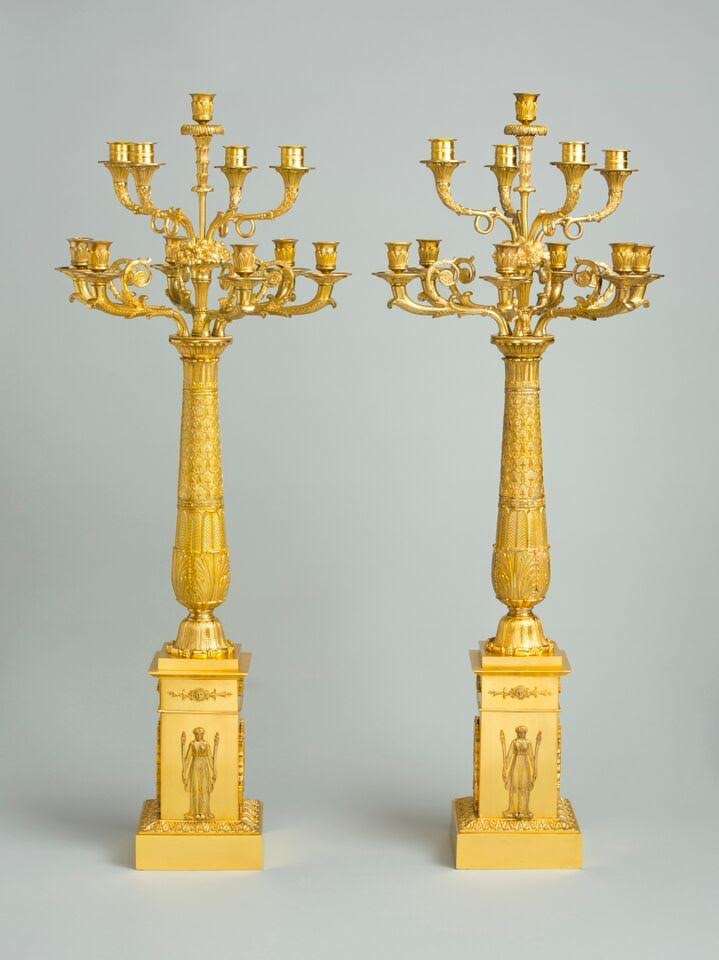 An important pair of Empire Berlin ormolu candelabra